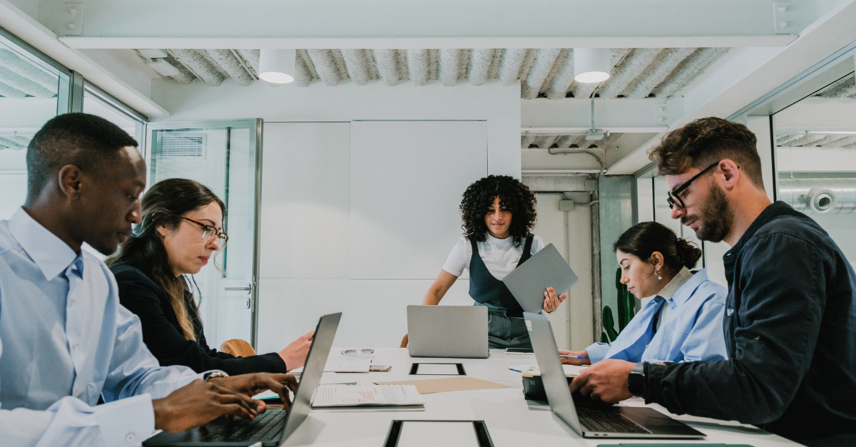 Senior enterprise leaders discussing B2B brand perception and market positioning in a global boardroom